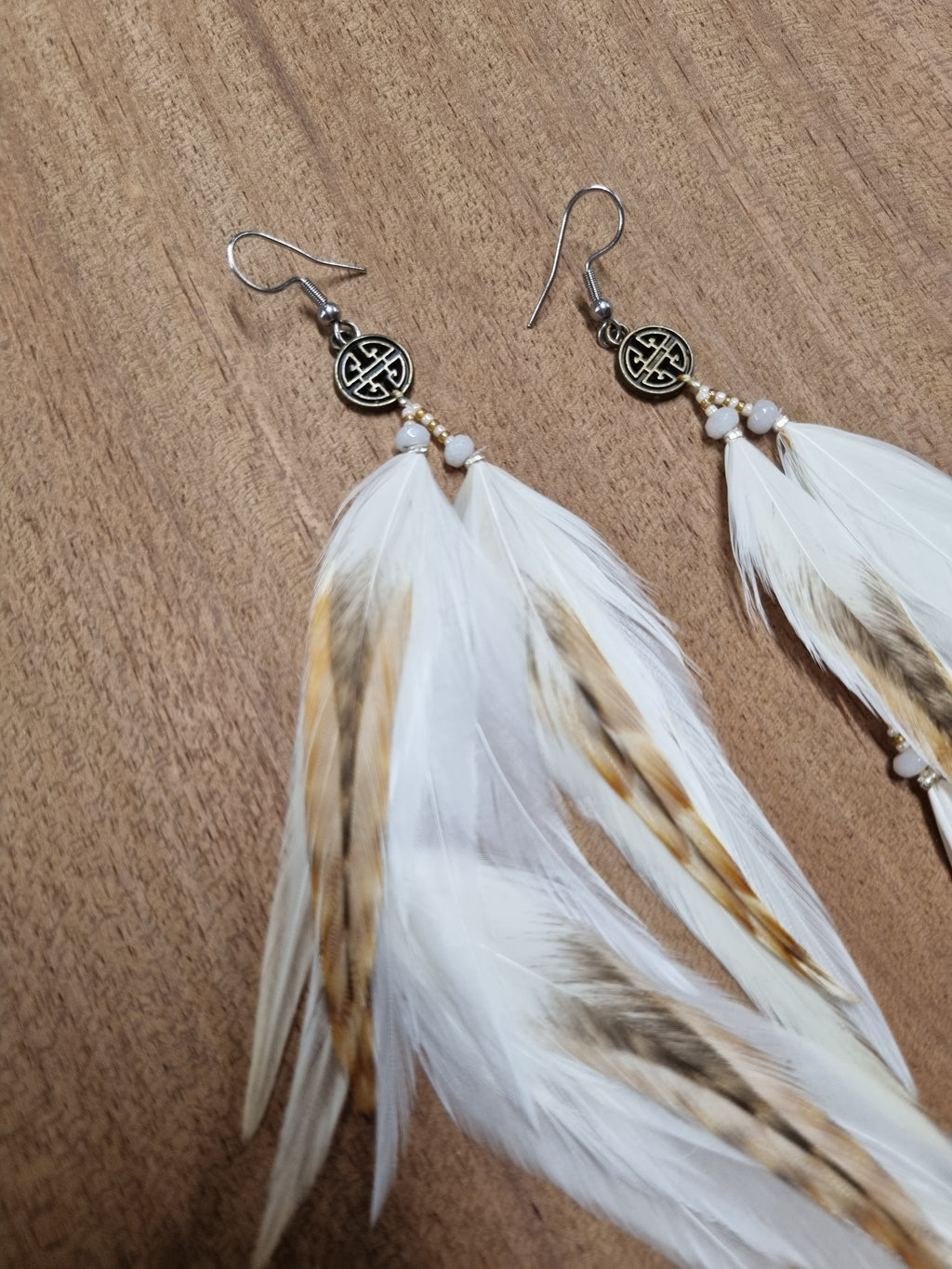 Feather earrings • White and striped feathers with a coin (short)